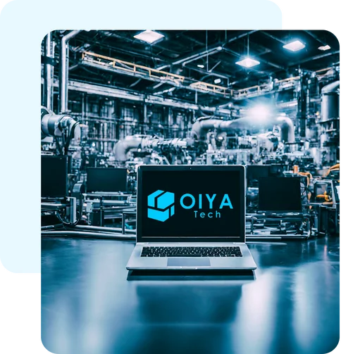 laptop on a desk in an industrial background with OIYA logo on the screen